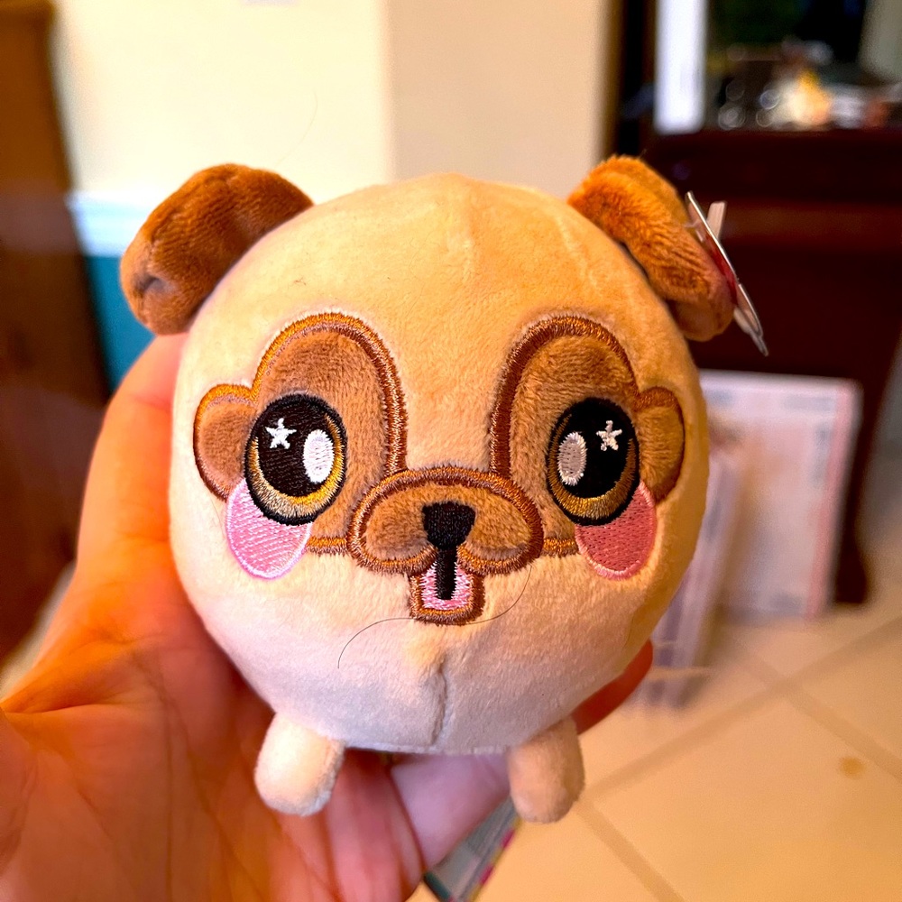 Squeezeamal puppy dog! New with tags! Squeezes in the palm of your hand,